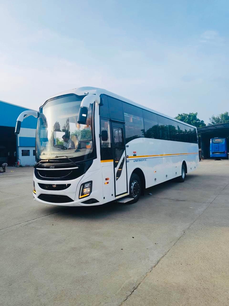 Qutbi Travels AC coach bus front angle view